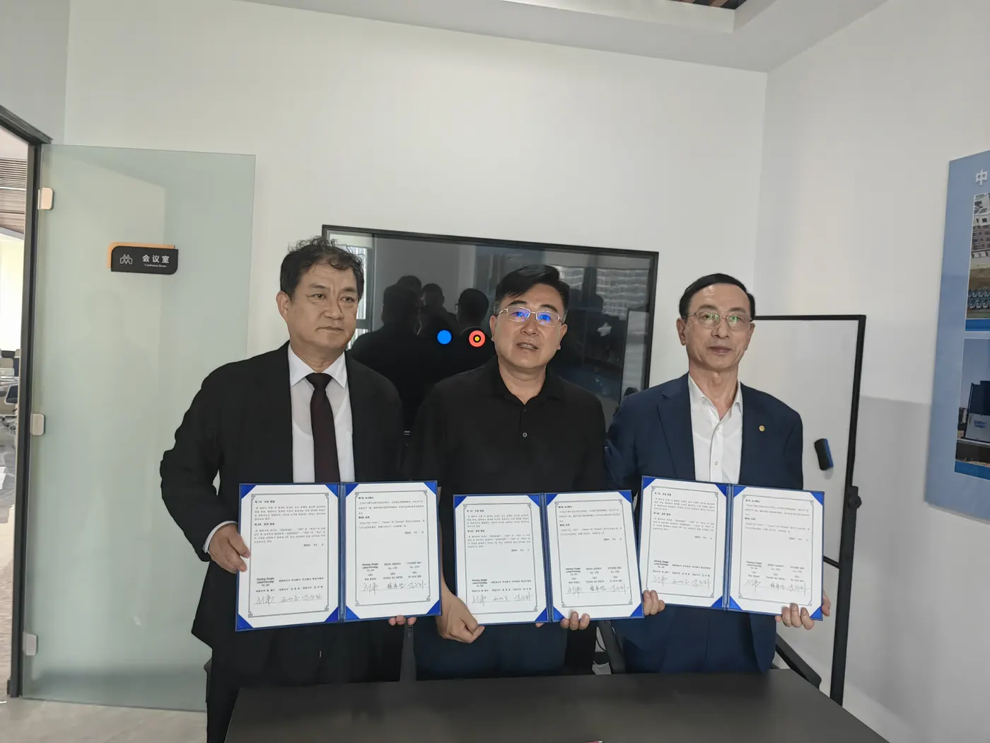 Korean partners and Cassky representative presenting signed cooperation agreements